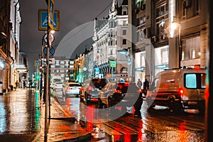 Wet night city street rain Bokeh reflection bright colorful lights puddles sidewalk Car