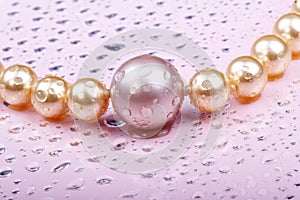 Wet pearls on pink photo