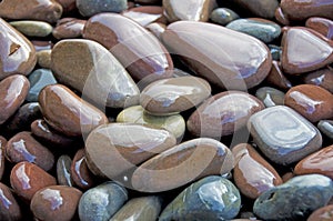 Wet pebbles on beach photo