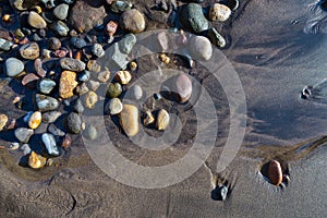 Wet pebbles on beach