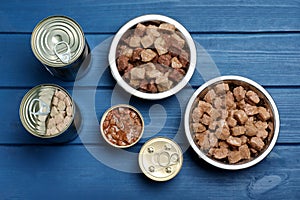 Wet pet food on blue wooden table, flat lay