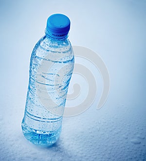 Wet plastic bottle of water