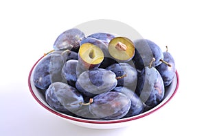 Wet plums in plate