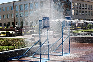 A wet, powerful stream of water splashes and shoots at the target, with a lot of pressure on the street at the attraction