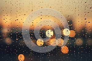 A wet rainy window, a blurred background of the lights of the night city