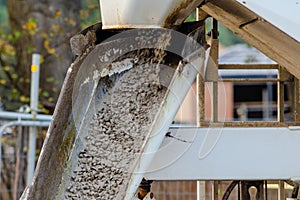 Wet ready mix concrete delivered on construction site and discarged of the wagon