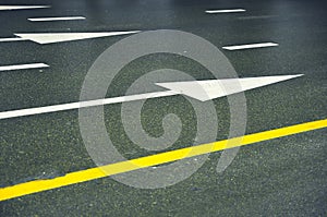 Wet road with arrows