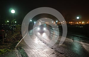 Wet road at night