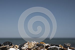 Wet sea pebbles on a summer beach