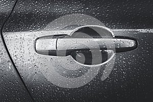 Wet silver handle door of a car