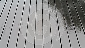 Wet slatted floor lined up on the background