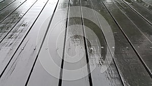 Wet slatted floor lined up on the background