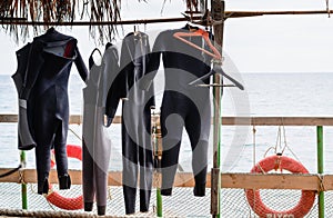 Wet Suits Hanging to Dry on Boat Deck