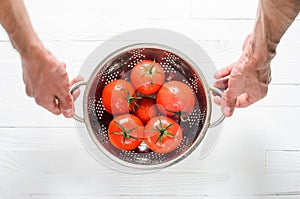 Wet Tomatoes in a Colander After Washing