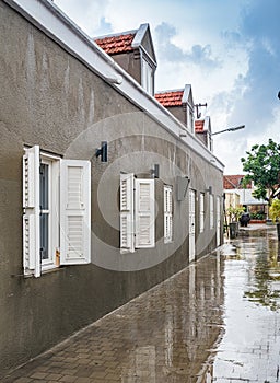 A wet walk around old buildings in Petermaai