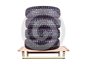 Wet, winter tires isolated on white background