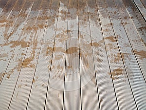 Wet wooden panels near a pool area