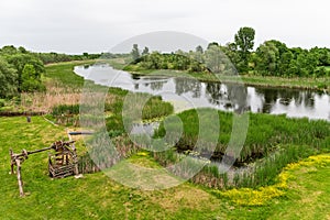 Wetland area with floodplain meadows and forests.