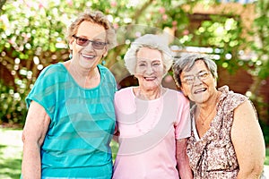 Weve been best friends forever. Portrait of a group of smiling senior women standing outside.