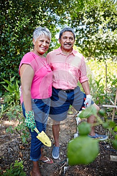 Weve been gardening together since the day we got married. a happy senior couple gardening together in their backyard.