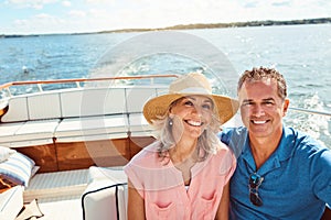 Weve got the sea all to ourselves. Portrait of a mature couple enjoying a relaxing boat ride.