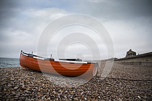 WEYMOUTH, DORSET, UK - DECEMBER 26. 2017. Dark skies over Chesil famous for its pebble beach in Weymouth, a coastal town in the