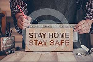 WFH: Carpenter working from home. Stay home Stay safe woodwork concept. Social Distancing