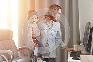 WFH concept, Young mother in home office with computer and her son