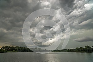 `Whales mouth`: dramatic sky over a lake at the back of a  severe thunderstorm