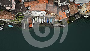 The wharf. Boats. Small boats. A small river pier. The crossing. Water. Gandria. Lugano. Switzerland. Italy. Lake