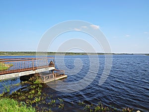 Wharf Dock Metal Wooden Pier on Lake Water Landscape with Blue Sky