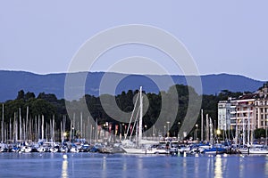 Wharf of Lake Geneva at dusk seen from lake side, Switzerland