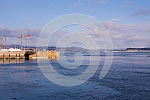 Wharf in the old town harbour sector, with the Island of Orleans and the north shore in the background, Quebec City photo