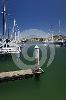 wharf and yacht boats in water at coffs harbour nsw in Australia