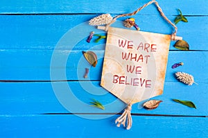 We are what we believe text on Paper Scroll