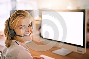 What can I do for you. Cropped portrait of an attractive young woman working in a call center.