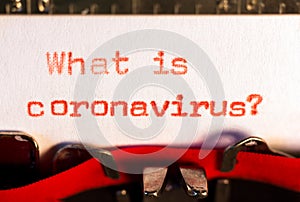 `What is coronavirus ?` on typewriter on red