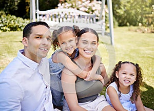 What could be better than this. Portrait of a happy young family enjoying a fun day out at the park.