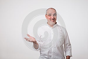 What do you mean concept. Puzzled mature man in white shirt