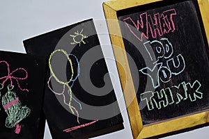 WHAT DO YOU THINK on phrase colorful handwritten on blackboard