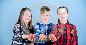 We are what we eat. Healthy children. Small group of children enjoy fresh eating apples. Little children holding red