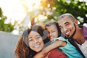 This is what happily ever after looks like. a happy little girl and her parents having fun in their backyard.