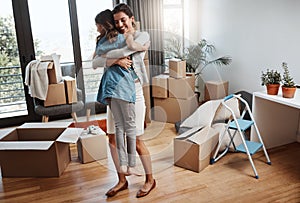 This is what happiness looks like. Full length shot of an attractive young woman and her daughter dancing while moving