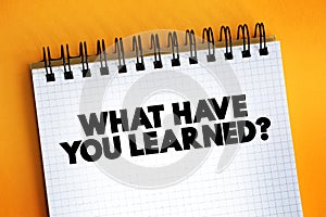 What Have You Learned question text quote on notepad, concept background