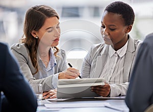 What if we use this idea here. two young businesswomen sitting together in the office and having a discussion while