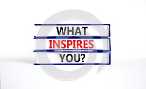 What inspires you symbol. Concept words What inspires you on beautiful book. Beautiful white table white background. Business
