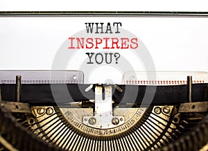 What inspires you symbol. Concept words What inspires you typed on beautiful retro old typewriter. Beautiful white background.