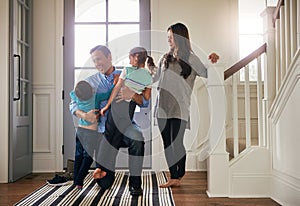 This is what its all about. a father arriving home to a loving welcome from his family.