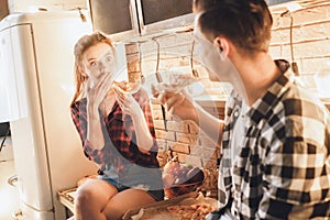 What, realy? Amazement woman with shocked face eating pizza