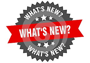 what's new? sign. what's new? round isolated ribbon label.